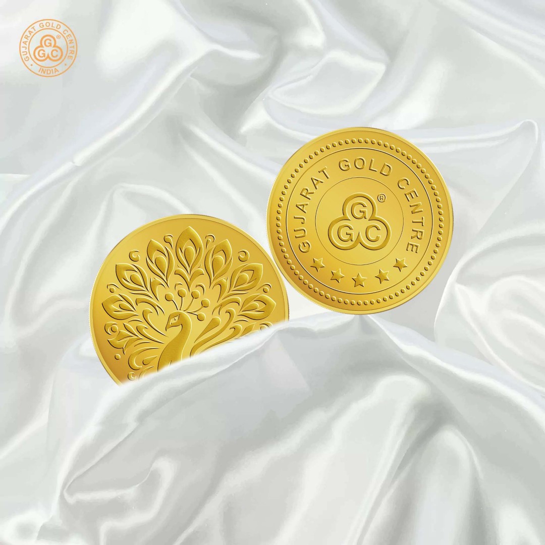 5gm 24K gold coin with embossed peacock design in full feather spread,  polished finish, GGC logo and hallmark engraved on back.