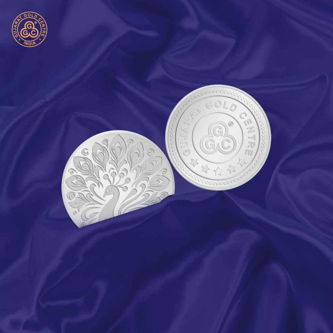 10gm 999 silver coin with elegant embossed peacock design on front  and GGC logo with hallmark on back, glossy and detailed finish.