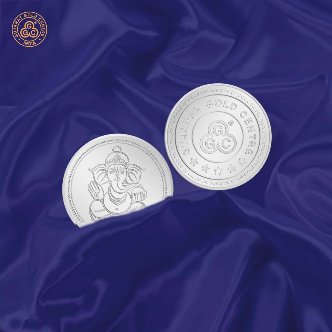 10gm 999 silver coin with detailed embossed Lord Ganesha sitting pose on front,  polished finish, GGC logo and hallmark on back.